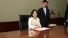 Taiwan's President Tsai Ing-wen signs her first document at her new desk following the inauguration ceremony at the Presidential Office in Taipei, Taiwan May 20, 2016. 