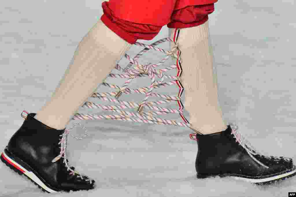 A model presents a creation for fashion house Moncler Gamme Bleu during the Men's Fall-Winter 2017-2018 fashion week in Milan, Italy, Jan. 15, 2017.