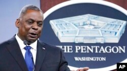 FILE - Defense Secretary Lloyd Austin speaks during a briefing at the Pentagon in Washington, May 6, 2021. 