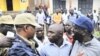 Uganda's main opposition leader Kizza Besigye (3rd L) and his supporters are blocked by policemen during a 'walk-to-work' protest in Kasangati suburb near Uganda's capital Kampala, (file photo)