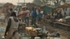 People are seen in a camp for internally dispersed persons at the airport of Bangui, Jan. 19, 2014. 