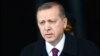 FILE - Turkey's President Tayyip Erdogan arrives for a welcoming ceremony at the Presidential Palace in Ankara, March 3, 2015. 