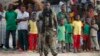 A Seleka fighter stands in a village close to the border of the Democratic Republic of Congo, June 10, 2014.