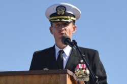 Captain Brett Crozier addresses the crew for the first time as commanding officer of the aircraft carrier USS Theodore Roosevelt in San Diego, California, March. 1, 2020.