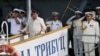 Russian Navy and a Philippine officer salute as Philippine President Rodrigo Duterte alights from the Russian anti-submarine Navy vessel Admiral Tributs in Manila, Philippines, Jan. 6, 2017.