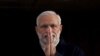 FILE - India's Prime Minister Narendra Modi holds up his hands in a "namaste," a traditional Indian greeting, as he arrives for an official visit to Britain, in London, Nov. 12, 2015.