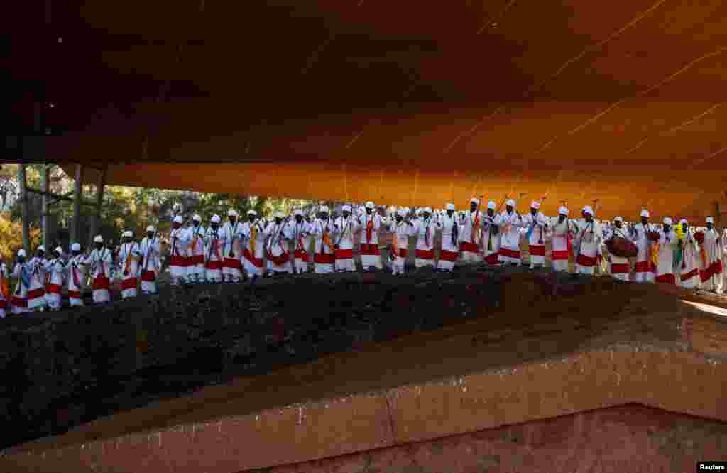 Ethiopian Orthodox choir members perform during Ethiopian Christmas celebration in Bete Maryam (House of Mary) monolithic church in Lalibela, Ethiopia, Jan. 7, 2017.