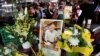 People pay their respects for Sisto Malaspina, who was killed Nov. 9, 2018, in a stabbing attack in Melbourne. Malaspina, 74, an icon of Melbourne's thriving culinary culture, was killed by Somali-born Australian Hassan Khalif Shire Ali.