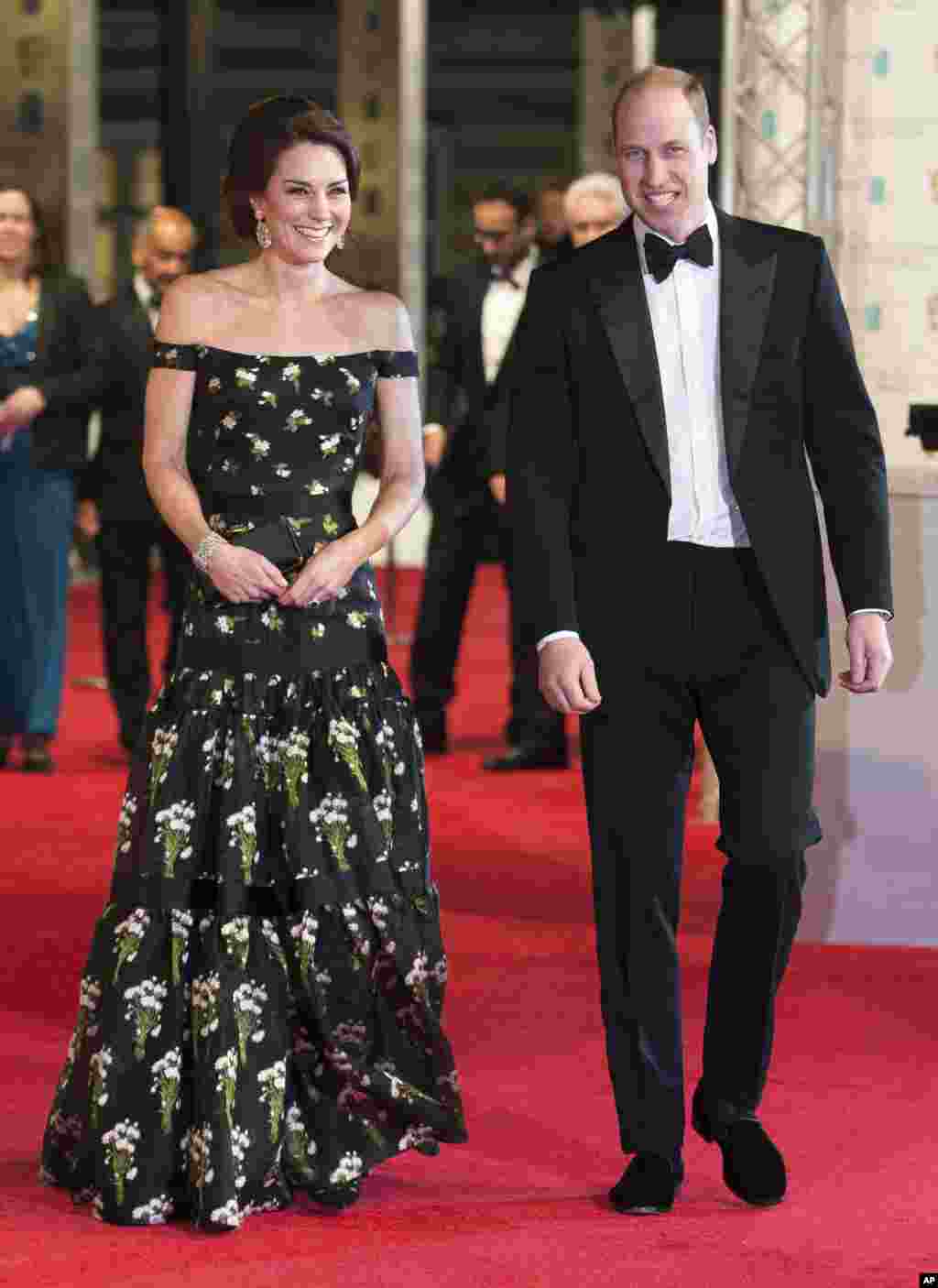 Britain's Prince William, Duke of Cambridge, right, and Britain's Kate, Duchess of Cambridge, arrive to attend the BAFTA British Academy Film Awards at the Royal Albert Hall in London, Feb. 12, 2017.