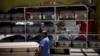 Vendors carry a coffin to deliver it to a funeral home as the coronavirus outbreak continues, in Ciudad Juarez, Mexico, May 19, 2021. 