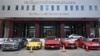 Rows of luxury cars seized from The iCon Group are seen at the Central Investigation Bureau in Bangkok on October 17, 2024. Police arrested 18 people, including three celebrities, and seized luxury cars and millions of dollars in connection with a pyramid scheme, officers said.
