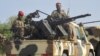 FILE - A convoy of Cameroon's army soldiers as part of a reinforcement of its military forces against Nigerian Islamist group Boko Haram.