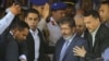 Egypt's President-elect Mohammed Morsi is guarded by presidential security as he leaves Friday prayers at Al-Azhar mosque, in Cairo, Egypt, Friday, June 29, 2012.