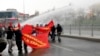 FILE - Protesters run from water cannons used by riot police to disperse a rally in Istanbul March 11, 2015.
