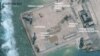 A satellite image released by the Asian Maritime Transparency Initiative at Washington's Center for Strategic and International Studies shows construction of possible radar tower facilities in the Spratly Islands in the disputed South China Sea in this im