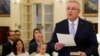 New Australian Prime Minister Scott Morrison is seen at his swearing-in ceremony as his wife Jenny looks on, in Canberra, Australia, Aug. 24, 2018.
