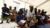 Congolese patients wait to be treated at a hospital run by Medecins Sans Frontieres (MSF) in Bunia, in northeastern Democratic Republic of Congo, June 27, 2003. 