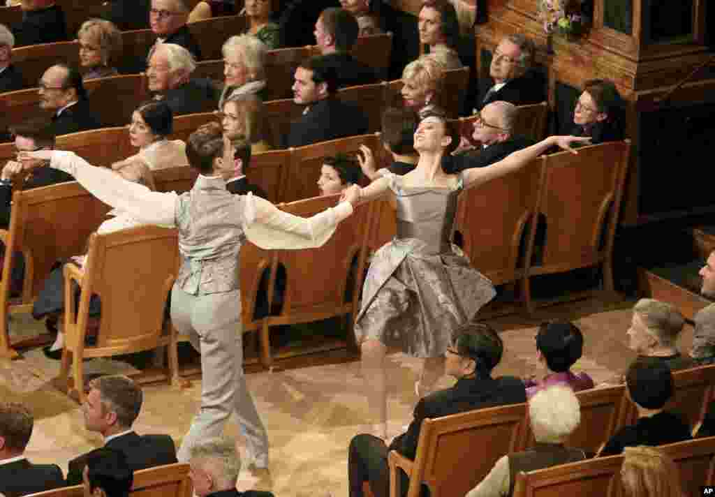 Young ballet dancers perform during the traditional New Year’s Concert of the Vienna Philharmonic Orchestra at the Golden Hall of the Musikverein in Vienna, Austria.