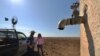 Farmers Matt and Sandra Ireson on their property, Sept. 28, 2018, during a severe and prolonged drought outside the town of Booligal in western New South Wales. Rainfall in 2018 was 75 percent below average.