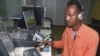 Hassan Yusuf monitors a computer in the control room during a live broadcast of the Somali government run radio. Al-Shabab controls most of southern Somalia uses the Internet and radio stations to get its message out, FILE March 1, 2010.