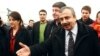 FILE - Pro-Kurdish politicians Sirri Sureyya Onder (R), Pelvin Buldan (L) and Altan Tan (C), are surrounded by media members before leaving for Imrali island in Istanbul, Feb. 23, 2013. 