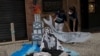 Activists hold a cutout depicting a whale skeleton on World Ocean Day, in Rio de Janeiro, Brazil June 8, 2021.
