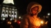 Mourners gather for a candlelight vigil at the Wisconsin State Capitol building a day after a shooting at Abundant Life Christian School, in Madison, Wisconsin, Dec. 17, 2024.