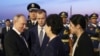 FILE - Russian President Vladimir Putin, left, shakes hands with Chinese State Councilor Shen Yiqin, second right, upon his arrive at the Beijing Capital International Airport in Beijing, May 16, 2024. 