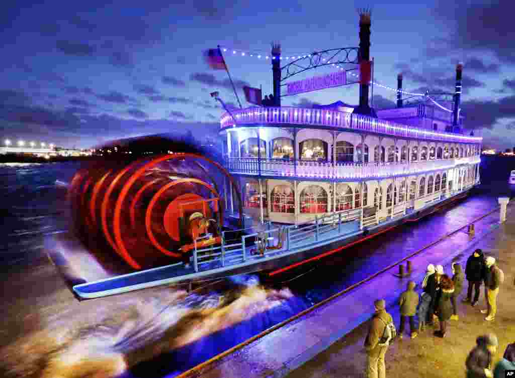 A paddle steamer Louisiana Star carrying tourists leaves Hamburg harbor in Germany.