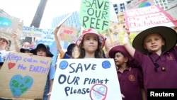 School children take part in the global #ClimateStrike rally, in Brisbane, Australia, March 15, 2019.
