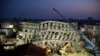 In the early morning, emergency rescuers continue to search for the missing in a collapsed building from an earthquake in Tainan, Taiwan, Feb. 7, 2016. 