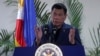 Philippine President Rodrigo Duterte interacts with reporters during a news conference upon his arrival from a four-day state visit in China at the Davao International Airport in Davao city, Philippines, Oct. 21, 2016.