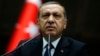FILE - President Erdogan addresses members of parliament from his ruling AK Party (AKP) at the Turkish parliament in Ankara.