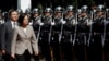 FILE - Taiwanese President Tsai Ing-wen inspects honor guard before a ceremony to mark the 92nd anniversary of the Whampoa Military Academy, in Kaohsiung, southern Taiwan, June 16, 2016.