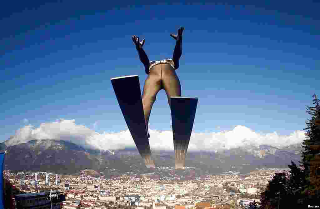 Germany&#39;s Karl Geiger soars through the air during the 65th four-hills ski jumping tournament trial round in Innsbruck, Austria.