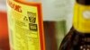 FILE - A label with a health warning is displayed on an alcoholic beverage bottle in Sydney, Australia, July 12, 2011.
