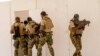 In this Feb. 18, 2020, photo, Nigerian Navy Special Boat Service troops exercise under the supervision of British special forces during U.S. military-led annual counterterrorism exercise in Thies, Senegal. 
