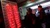 People check currency exchange rates at an currency exchange office in Istanbul, Dec. 16, 2014. 
